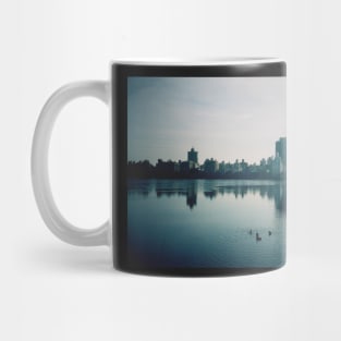 Film photo of Central Park, New York City, with its lake and surrounded buildings Mug